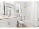 Clean bathroom with a tub shower combo, white vanity, and tile floor at 8725 Sundance Loop, Sarasota, FL 34238