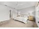 Spacious bedroom with en-suite bathroom access, featuring neutral tones and ample natural light at 8725 Sundance Loop, Sarasota, FL 34238
