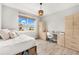 Bedroom with a queen bed, built-in desk and storage at 8725 Sundance Loop, Sarasota, FL 34238