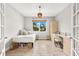 Bedroom with a queen bed, built-in desk and storage at 8725 Sundance Loop, Sarasota, FL 34238
