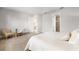 Relaxing bedroom with access to a full bathroom and plenty of space at 8725 Sundance Loop, Sarasota, FL 34238