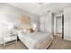 Bedroom with queen bed, built-in shelving and access to bathroom at 8725 Sundance Loop, Sarasota, FL 34238