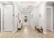 Light and airy entryway with wood-look floors at 8725 Sundance Loop, Sarasota, FL 34238