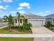 Charming house exterior with landscaped yard and driveway at 8725 Sundance Loop, Sarasota, FL 34238