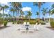 Community fire pit with surrounding seating for gatherings at 8725 Sundance Loop, Sarasota, FL 34238