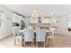 Bright kitchen with white cabinets, stainless steel appliances, and an island at 8725 Sundance Loop, Sarasota, FL 34238