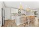 Kitchen island with seating and a view into the adjacent dining area at 8725 Sundance Loop, Sarasota, FL 34238