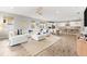 Spacious living room features a large sectional sofa and an open floor plan at 8725 Sundance Loop, Sarasota, FL 34238