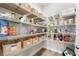 Well-organized pantry with ample shelving for storage at 8725 Sundance Loop, Sarasota, FL 34238