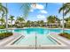 Large community pool with plenty of lounge chairs at 8725 Sundance Loop, Sarasota, FL 34238
