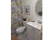 Clean bathroom with floral shower curtain and updated vanity at 1002 Oakleaf Blvd, Bradenton, FL 34208