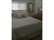 Bedroom with double bed and neutral colored bedding and pillows at 1002 Oakleaf Blvd, Bradenton, FL 34208