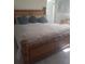 Main bedroom with bamboo bed frame and neutral bedding at 1002 Oakleaf Blvd, Bradenton, FL 34208