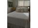 Bright bedroom with double bed and neutral bedding at 1002 Oakleaf Blvd, Bradenton, FL 34208