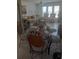 Casual dining area with a glass-top table and wicker chairs at 1002 Oakleaf Blvd, Bradenton, FL 34208