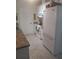 Updated kitchen with white cabinets, granite countertops, and a stainless steel refrigerator at 1002 Oakleaf Blvd, Bradenton, FL 34208