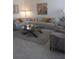Spacious living room featuring a large sectional sofa and a stylish coffee table at 1002 Oakleaf Blvd, Bradenton, FL 34208