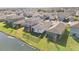 Aerial view of lakefront houses and neighborhood at 10435 Ladybug Cv, Parrish, FL 34219