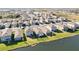 Aerial view of houses with lakefront access at 10435 Ladybug Cv, Parrish, FL 34219
