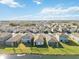 Aerial view of houses with lakefront access at 10435 Ladybug Cv, Parrish, FL 34219