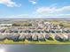 Aerial view of lakefront houses and neighborhood at 10435 Ladybug Cv, Parrish, FL 34219