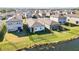 Aerial view of houses with lakefront access at 10435 Ladybug Cv, Parrish, FL 34219