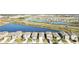 Aerial view of houses near a lake with a beautiful landscape at 10435 Ladybug Cv, Parrish, FL 34219