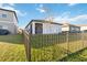 Fenced backyard with view of a tree and canal at 10435 Ladybug Cv, Parrish, FL 34219