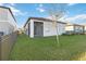 Spacious backyard with a screened patio and privacy fence at 10435 Ladybug Cv, Parrish, FL 34219