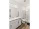 Bathroom with a walk-in shower, toilet and vanity at 10435 Ladybug Cv, Parrish, FL 34219