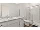 Clean bathroom with walk-in shower and vanity at 10435 Ladybug Cv, Parrish, FL 34219