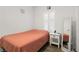 Bedroom with full-size bed and wood-look floors at 10435 Ladybug Cv, Parrish, FL 34219