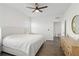 Spacious bedroom with king-size bed and wood-look floors at 10435 Ladybug Cv, Parrish, FL 34219