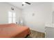 Bedroom with queen-size bed and wood-look floors at 10435 Ladybug Cv, Parrish, FL 34219