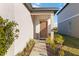 Front entry with walkway and potted plants at 10435 Ladybug Cv, Parrish, FL 34219