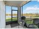 Relaxing screened porch overlooking a lake at 10435 Ladybug Cv, Parrish, FL 34219