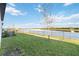 Backyard view featuring a canal and lush grass at 10435 Ladybug Cv, Parrish, FL 34219
