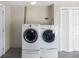 Laundry room with washer and dryer included at 10820 Oldham Rd, Port Richey, FL 34668