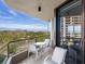 Spacious balcony with outdoor seating and scenic water view at 1211 Gulf Of Mexico Dr # 301, Longboat Key, FL 34228