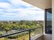 Stunning balcony view overlooking tennis courts, water, and cityscape at 1211 Gulf Of Mexico Dr # 301, Longboat Key, FL 34228