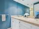 Clean bathroom with a single sink and blue walls at 1211 Gulf Of Mexico Dr # 301, Longboat Key, FL 34228