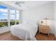 Comfortable bedroom with water views and wood floors at 1211 Gulf Of Mexico Dr # 301, Longboat Key, FL 34228