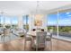 Elegant dining area with hardwood floors and ocean views at 1211 Gulf Of Mexico Dr # 301, Longboat Key, FL 34228