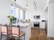 Modern white kitchen with stainless steel appliances and ocean views at 1211 Gulf Of Mexico Dr # 301, Longboat Key, FL 34228