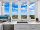 Modern kitchen with stainless steel appliances and ocean views at 1211 Gulf Of Mexico Dr # 301, Longboat Key, FL 34228