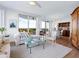 Spacious living room with hardwood floors, large windows, and ocean views at 1211 Gulf Of Mexico Dr # 301, Longboat Key, FL 34228