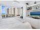 Bright bedroom with water views and built-in shelving at 1211 Gulf Of Mexico Dr # 301, Longboat Key, FL 34228