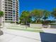 Outdoor shuffleboard court with a bench and landscaping at 1211 Gulf Of Mexico Dr # 301, Longboat Key, FL 34228