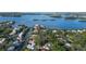 Aerial view of waterfront property showcasing a single Gathering home at 1411 Quail Dr, Sarasota, FL 34231