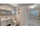 Clean bathroom with updated vanity and tiled shower at 1411 Quail Dr, Sarasota, FL 34231